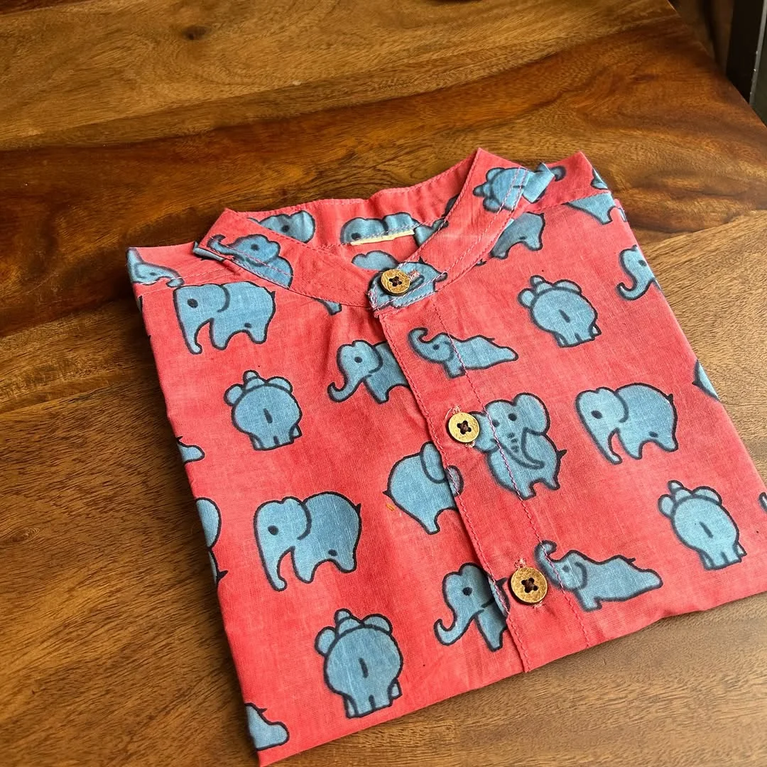 Blue elephant in a pink forest